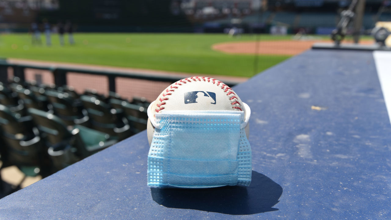 DETROIT, MI - JULY 05: A detailed view of an official Major League Baseball with a surgical mask placed on it sitting on the dugout during the Detroit Tigers Summer Workouts at Comerica Park on July 5, 2020 in Detroit, Michigan.