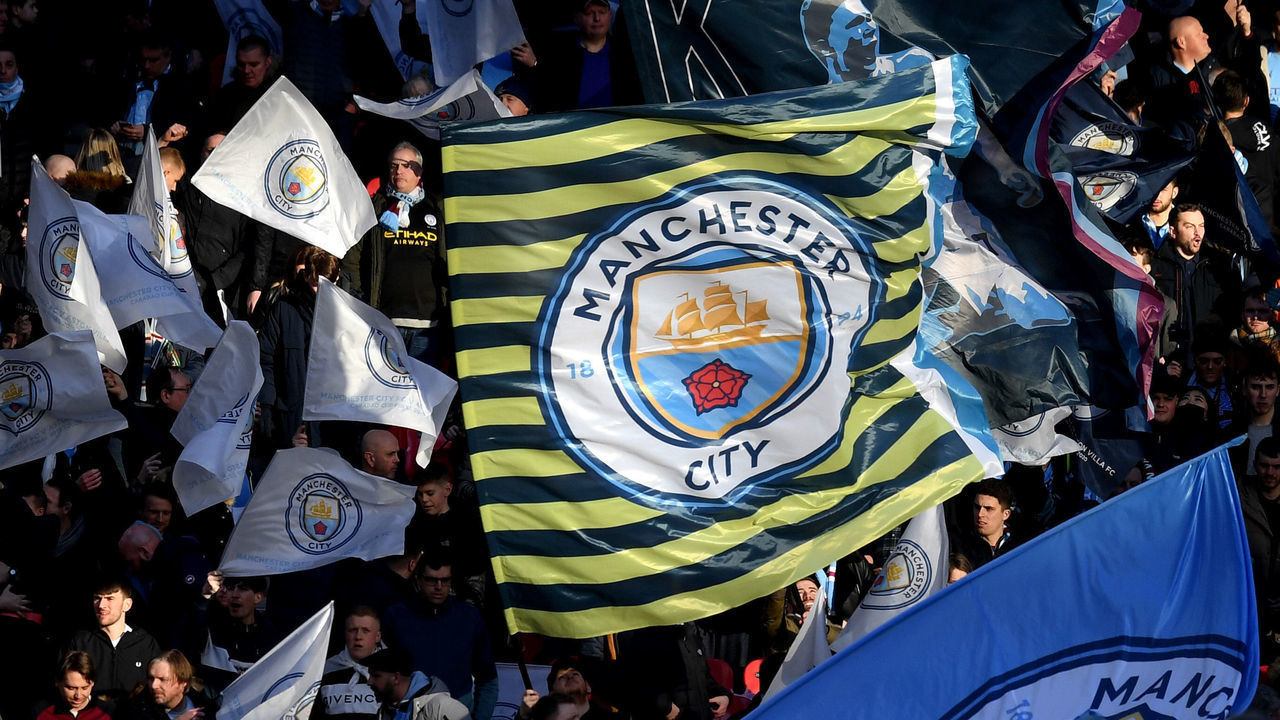 LONDON, ENGLAND - MARCH 01: Fans wave flags prior to the Carabao Cup Final between Aston Villa and Manchester City at Wembley Stadium on March 01, 2020 in London, England.