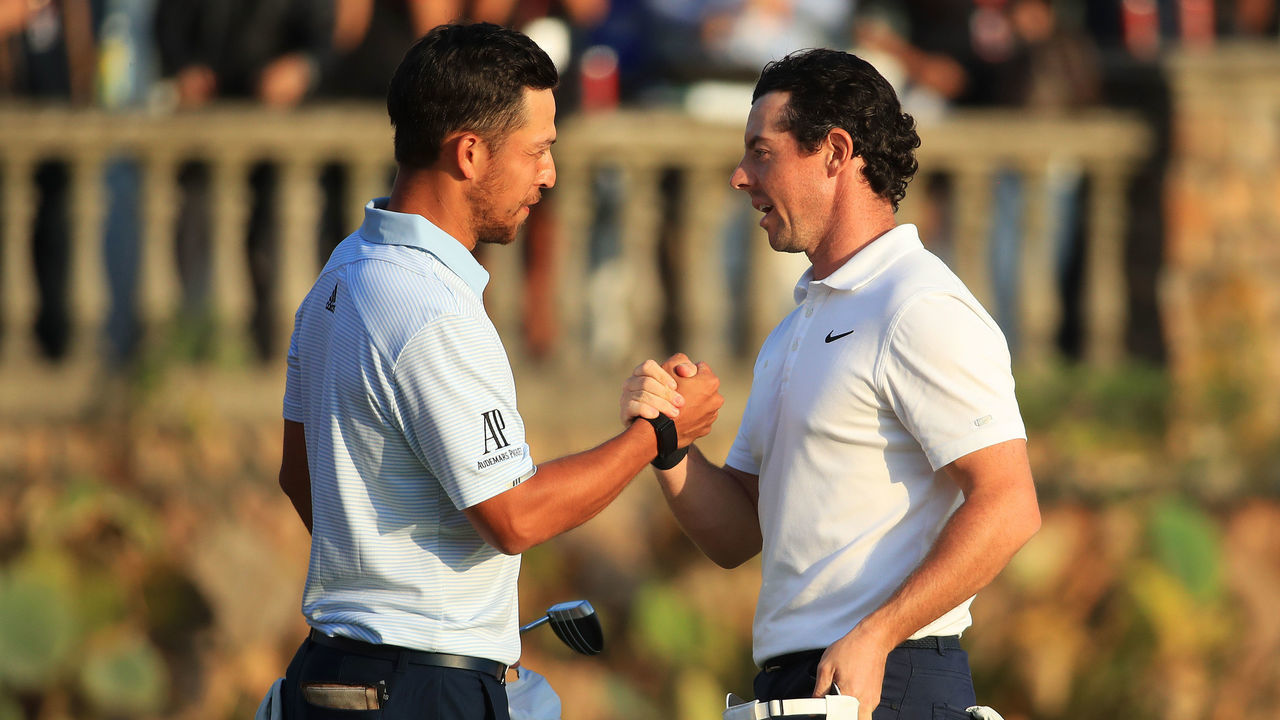SHANGHAI, CHINA - NOVEMBER 03: Rory McIlroy of Northern Ireland (R) shakes hands with Xander Schauffele of the United States after his victory in a playoff on the 18th green during Day Four of the WGC HSBC Champions at Sheshan International Golf Club on November 3, 2019 in Shanghai, China.