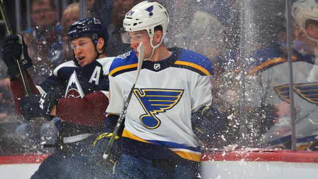 DENVER, CO - JANUARY 18: Colorado Avalanche Nathan MacKinnon (29), left, checks St. Louis Blues Vince Dunn (29) during 1st period of the game at Pepsi Center. Denver, Colorado. January 18, 2020. Colorado won 5-3.