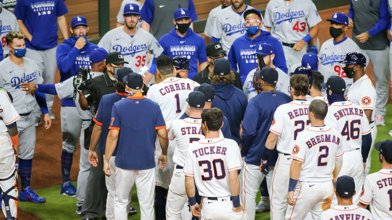 HOUSTON, TX - JULY 28: An altercation ensues after Houston Astros shortstop Carlos Correa (1) strikes out i the bottom of the sixth inning during the baseball game between the Los Angeles Dodgers and Houston Astros on July 28, 2020 at Minute Maid Park in Houston, Texas.