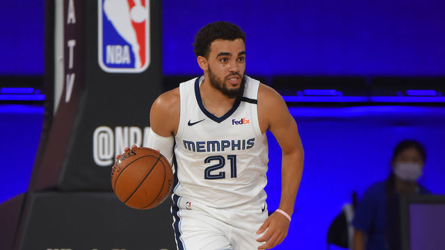 Orlando, FL - JULY 26: Tyus Jones #21 of the Memphis Grizzlies handles the ball against the Houston Rockets during a scrimmage on July 26, 2020 at HP Field House at ESPN Wide World of Sports in Orlando, Florida. NOTE TO USER: User expressly acknowledges and agrees that, by downloading and/or using this Photograph, user is consenting to the terms and conditions of the Getty Images License Agreement. Mandatory Copyright Notice: Copyright 2020 NBAE