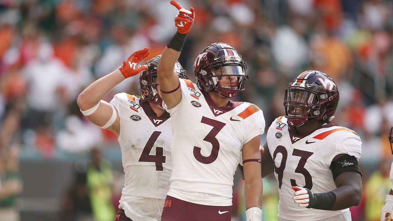 MIAMI, FLORIDA - OCTOBER 05: Caleb Farley #3 of the Virginia Tech Hokies celebrates with teammates against the Miami Hurricanes during the first half at Hard Rock Stadium on October 05, 2019 in Miami, Florida.