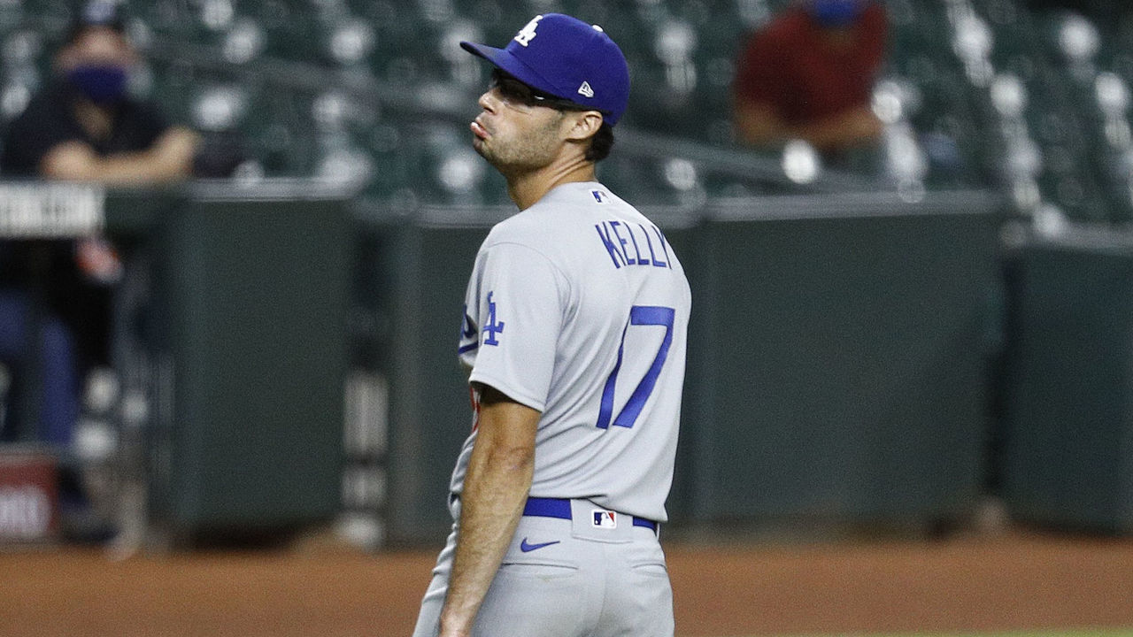 HOUSTON, TEXAS - JULY 28: Joe Kelly #17 of the Los Angeles Dodgers looks back at Carlos Correa #1 of the Houston Astros in the sixth inning as they exchange words after he knocked down Correa with a high pitch at Minute Maid Park on July 28, 2020 in Houston, Texas.