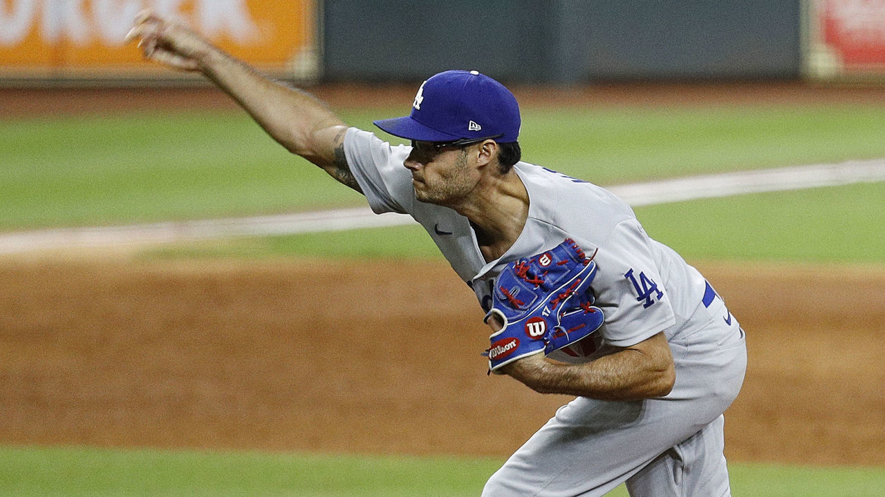 HOUSTON, TEXAS - JULY 28: Joe Kelly #17 of the Los Angeles Dodgers pitches against the Houston Astros in the sixth inning at Minute Maid Park on July 28, 2020 in Houston, Texas.