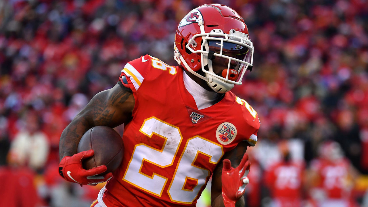 KANSAS CITY, MISSOURI - JANUARY 19: Damien Williams #26 of the Kansas City Chiefs runs with the ball in the second half against the Tennessee Titans in the AFC Championship Game at Arrowhead Stadium on January 19, 2020 in Kansas City, Missouri.