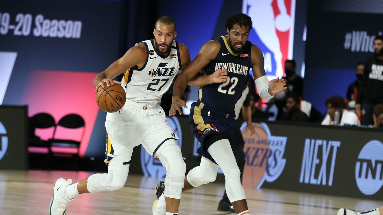 Orlando, FL - JULY 30: Rudy Gobert #27 of the Utah Jazz handles the ball against the New Orleans Pelicans on July 30, 2020 at HP Field House at ESPN Wide World of Sports in Orlando, Florida. NOTE TO USER: User expressly acknowledges and agrees that, by downloading and/or using this Photograph, user is consenting to the terms and conditions of the Getty Images License Agreement. Mandatory Copyright Notice: Copyright 2020 NBAE