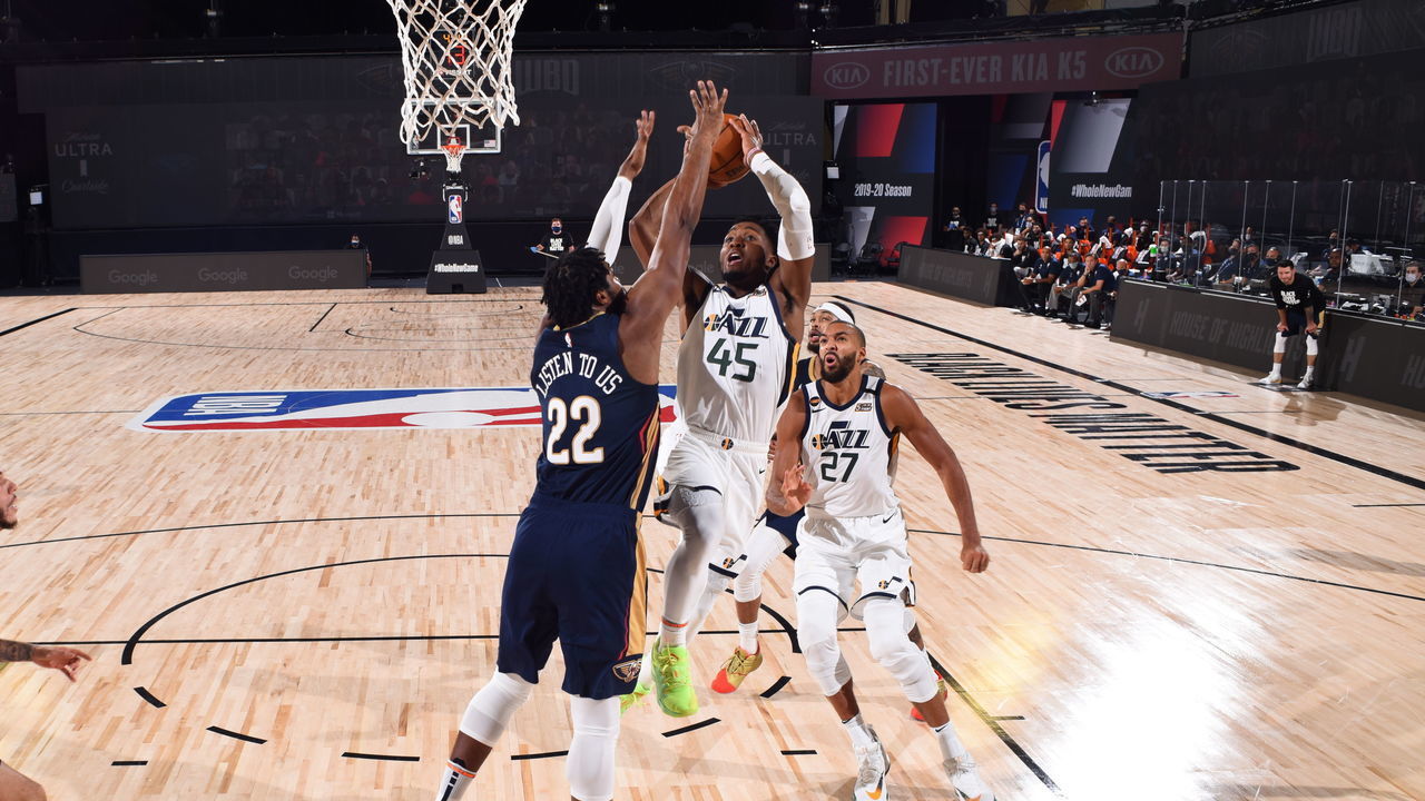 Orlando, FL - JULY 30: Donovan Mitchell #45 of the Utah Jazz drives to the basket during the game against the New Orleans Pelicans during a game on July 30, 2020 at The HP Field House at ESPN Wide World Of Sports Complex in Orlando, Florida. NOTE TO USER: User expressly acknowledges and agrees that, by downloading and/or using this Photograph, user is consenting to the terms and conditions of the Getty Images License Agreement. Mandatory Copyright Notice: Copyright 2020 NBAE