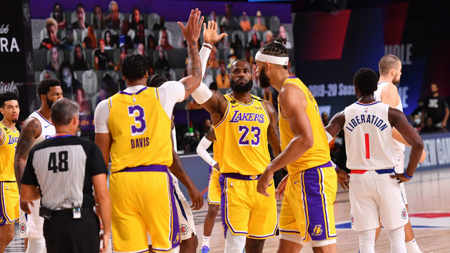 Orlando, FL - JULY 30: Anthony Davis #3 of the Los Angeles Lakers and LeBron James #23 of the Los Angeles Lakers high-five against the LA Clippers on July 30, 2020 at The Arena at ESPN Wide World Of Sports Complex in Orlando, Florida. NOTE TO USER: User expressly acknowledges and agrees that, by downloading and/or using this Photograph, user is consenting to the terms and conditions of the Getty Images License Agreement. Mandatory Copyright Notice: Copyright 2020 NBAE