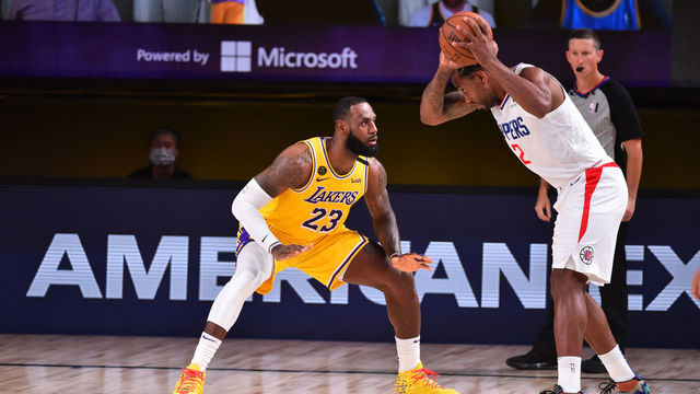 Orlando, FL - JULY 30: LeBron James #23 of the Los Angeles Lakers plays defense against Kawhi Leonard #2 of the LA Clippers on July 30, 2020 at The Arena at ESPN Wide World Of Sports Complex in Orlando, Florida. NOTE TO USER: User expressly acknowledges and agrees that, by downloading and/or using this Photograph, user is consenting to the terms and conditions of the Getty Images License Agreement. Mandatory Copyright Notice: Copyright 2020 NBAE