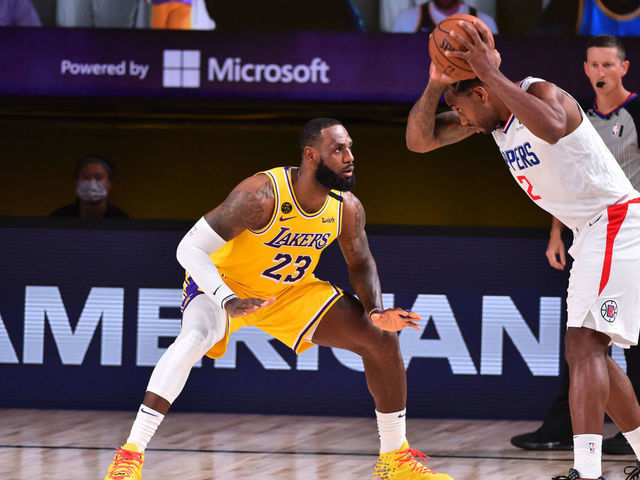 Orlando, FL - JULY 30: LeBron James #23 of the Los Angeles Lakers plays defense against Kawhi Leonard #2 of the LA Clippers on July 30, 2020 at The Arena at ESPN Wide World Of Sports Complex in Orlando, Florida. NOTE TO USER: User expressly acknowledges and agrees that, by downloading and/or using this Photograph, user is consenting to the terms and conditions of the Getty Images License Agreement. Mandatory Copyright Notice: Copyright 2020 NBAE