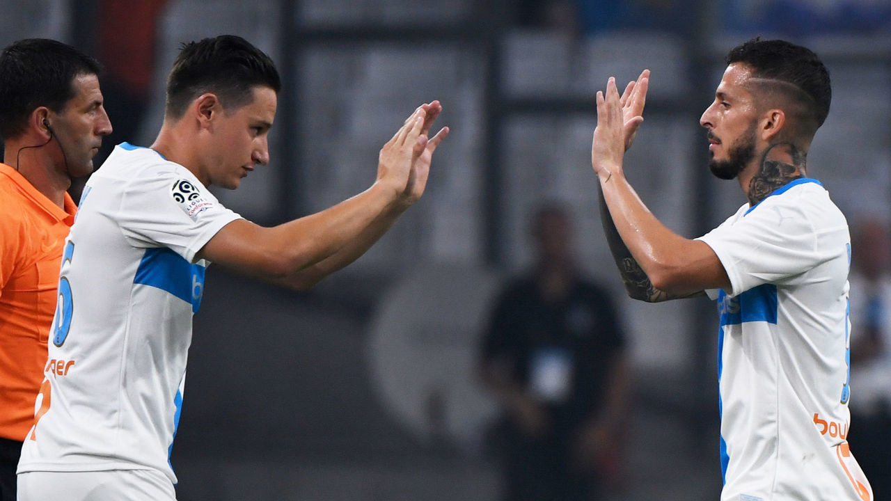 Marseille's French forward Florian Thauvin (L) replaces Marseille's Argentine forward Dario Benedetto during the French L1 football match between Marseille (OM) and Saint-Etienne (ASSE) at the Velodrome Stadium in Marseille, southeastern France, on September 1, 2019.