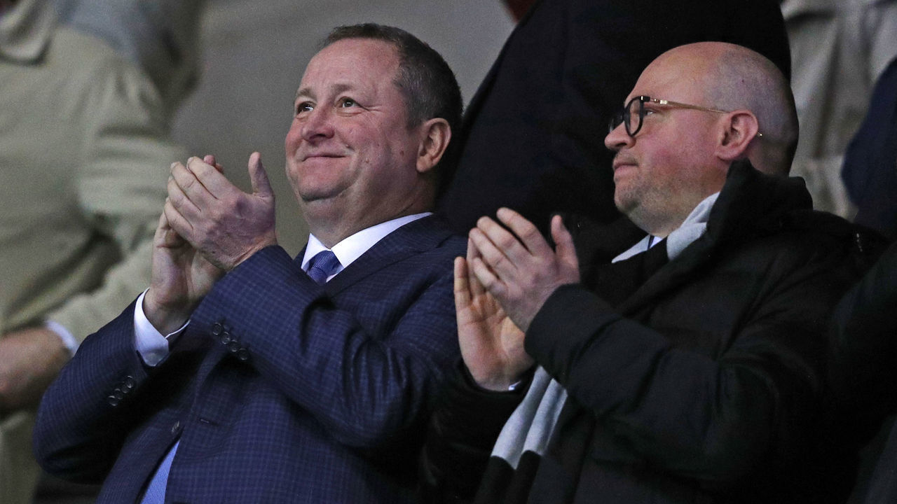 Newcastle United's English owner Mike Ashley (L) and director Lee Charnley (R) applaud after Newcastle take the lead during the FA Cup fourth round replay football match between Oxford United and Newcastle United at the Kassam Stadium in Oxford, west of London, on February 4, 2020.