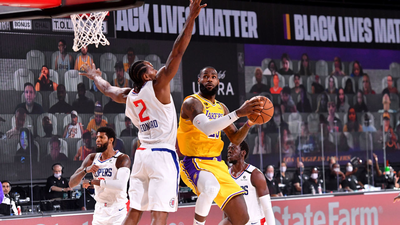 Orlando, FL - JULY 30: LeBron James #23 of the Los Angeles Lakers shoots the ball against Kawhi Leonard #2 of the LA Clippers on July 30, 2020 at The Arena at ESPN Wide World Of Sports Complex in Orlando, Florida. NOTE TO USER: User expressly acknowledges and agrees that, by downloading and/or using this Photograph, user is consenting to the terms and conditions of the Getty Images License Agreement. Mandatory Copyright Notice: Copyright 2020 NBAE