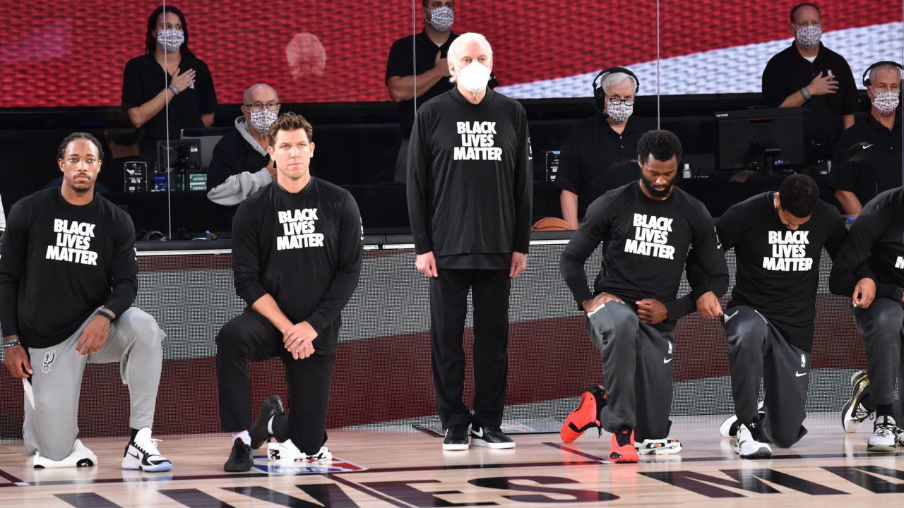 Orlando, FL - JULY 31: Head Coach, Gregg Popovich of the San Antonio Spurs stands during the National Anthem before the game against the Sacramento Kings on July 31, 2020 at Visa Athletic Center at ESPN Wide World of Sports in Orlando, Florida. NOTE TO USER: User expressly acknowledges and agrees that, by downloading and/or using this Photograph, user is consenting to the terms and conditions of the Getty Images License Agreement. Mandatory Copyright Notice: Copyright 2020 NBAE