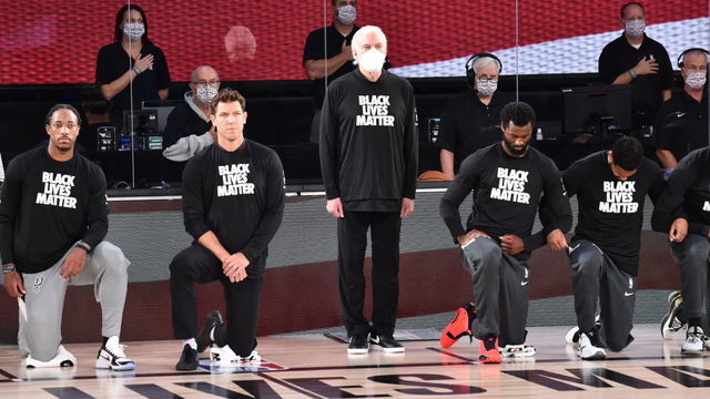 Orlando, FL - JULY 31: Head Coach, Gregg Popovich of the San Antonio Spurs stands during the National Anthem before the game against the Sacramento Kings on July 31, 2020 at Visa Athletic Center at ESPN Wide World of Sports in Orlando, Florida. NOTE TO USER: User expressly acknowledges and agrees that, by downloading and/or using this Photograph, user is consenting to the terms and conditions of the Getty Images License Agreement. Mandatory Copyright Notice: Copyright 2020 NBAE