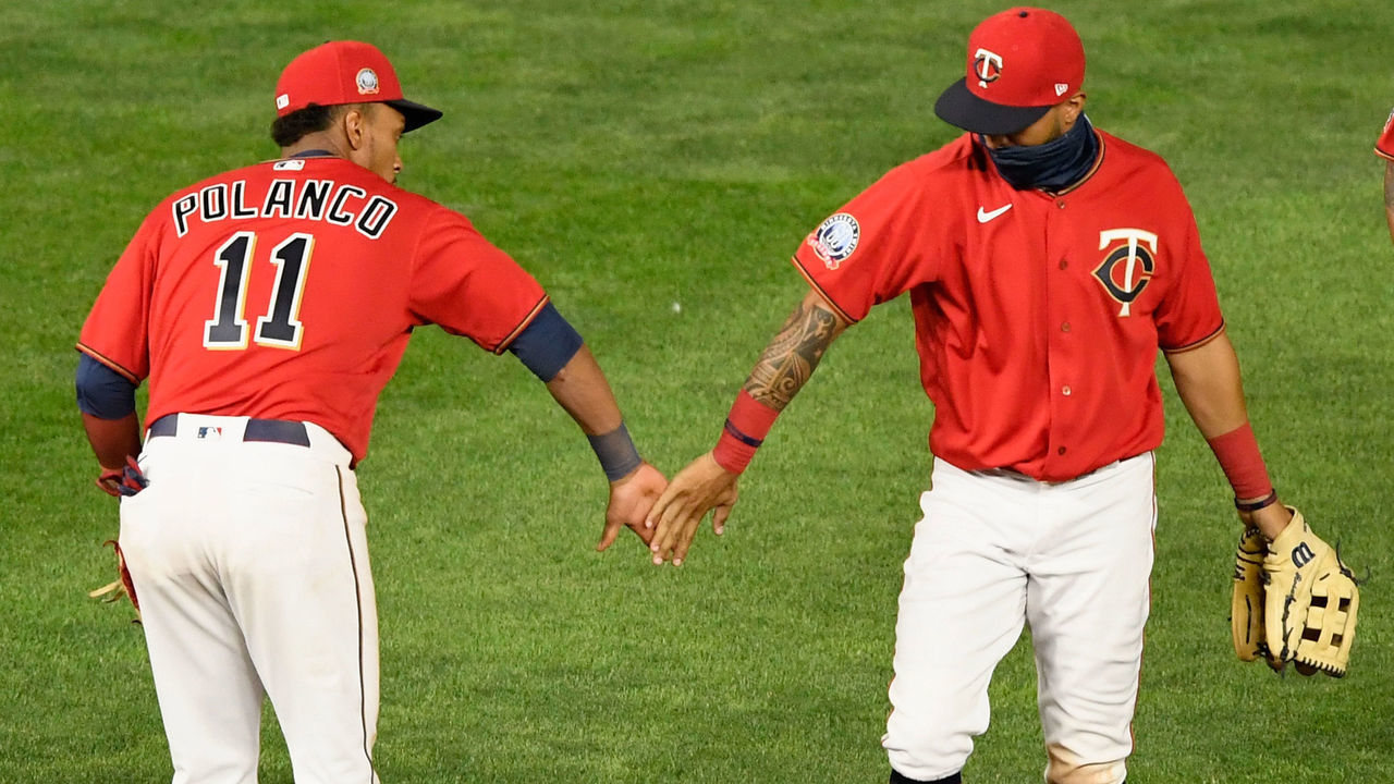 MINNEAPOLIS, MINNESOTA - JULY 31: Jorge Polanco #11 and Eddie Rosario #20 of the Minnesota Twins celebrate defeating the Cleveland Indians in the game at Target Field on July 31, 2020 in Minneapolis, Minnesota. The Twins defeated the Indians 4-1.
