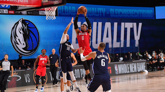 Orlando, FL - JULY 31: Russell Westbrook #0 of the Houston Rockets shoots the ball against the Dallas Mavericks on July 31, 2020 at The Arena at ESPN Wide World Of Sports Complex in Orlando, Florida. NOTE TO USER: User expressly acknowledges and agrees that, by downloading and/or using this Photograph, user is consenting to the terms and conditions of the Getty Images License Agreement. Mandatory Copyright Notice: Copyright 2020 NBAE