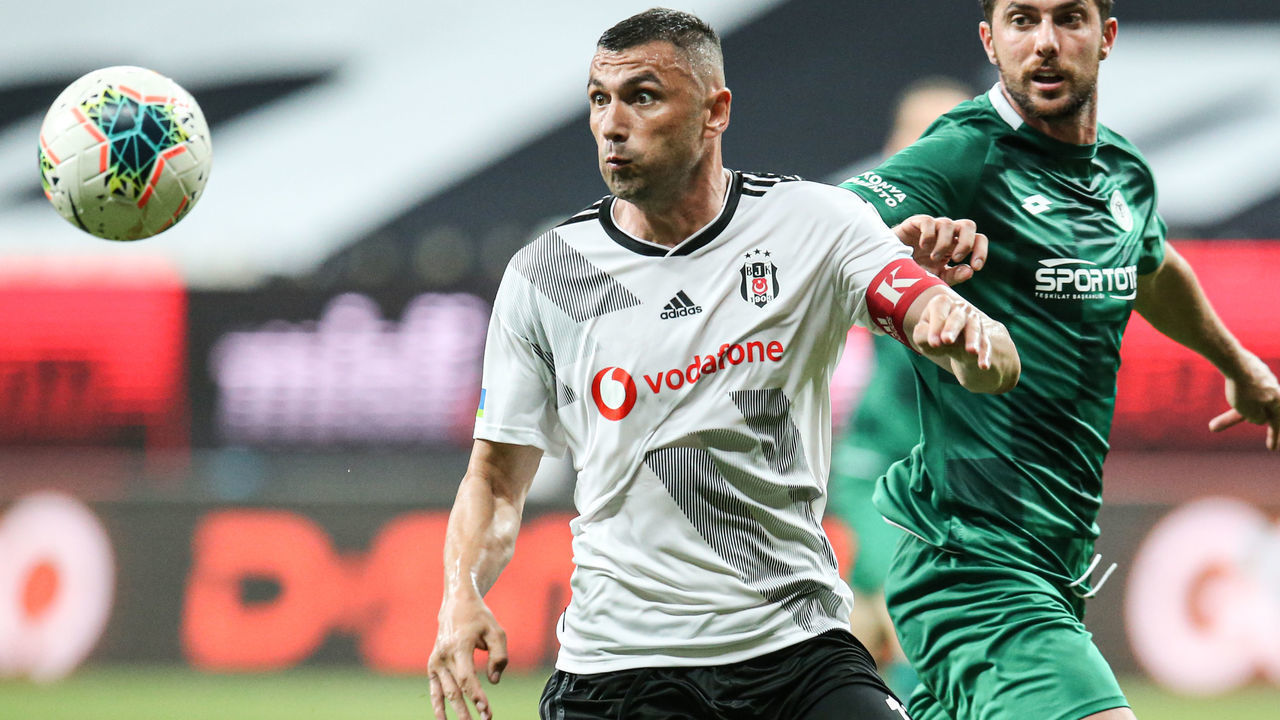 ISTANBUL, TURKEY - JUNE 26: Burak Yilmaz (L) of Besiktas in action during Turkish Super Lig week 29 soccer match between Besiktas and Ittifak Holding Konyaspor at Vodafone Park in Istanbul, Turkey on June 26, 2020.