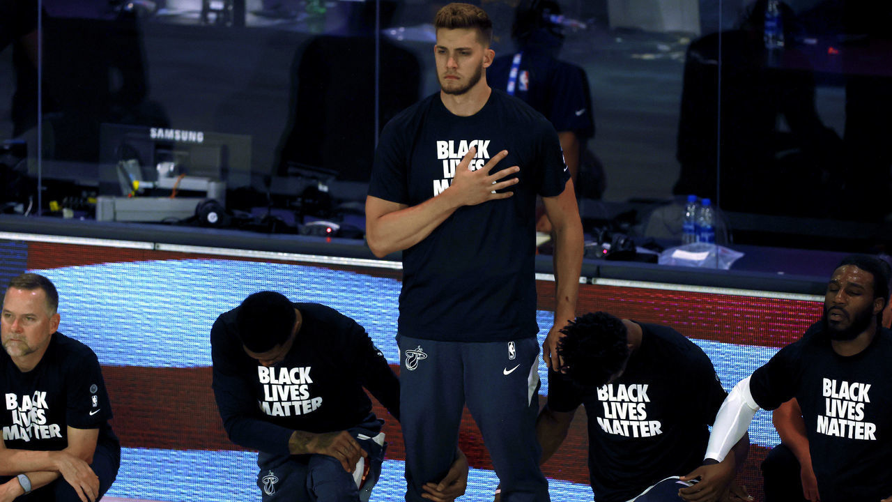 LAKE BUENA VISTA, FLORIDA - AUGUST 01: Meyers Leonard of the Miami Heat stands during the National Anthem before the start of a game against the Denver Nuggets at HP Field House at ESPN Wide World Of Sports Complex on August 01, 2020 in Lake Buena Vista, Florida.