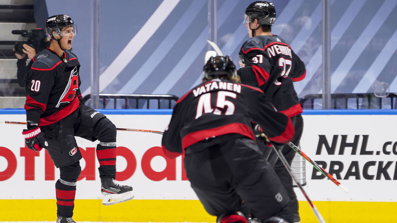 TORONTO, ONTARIO - AUGUST 01: Sebastian Aho #20 of the Carolina Hurricanes celebrates his goal against the New York Rangers with teammates Andrei Svechnikov #37 and Sami Vatanen #45 during the second period in Game One of the Eastern Conference Qualification Round at Scotiabank Arena on August 01, 2020 in Toronto, Ontario.
