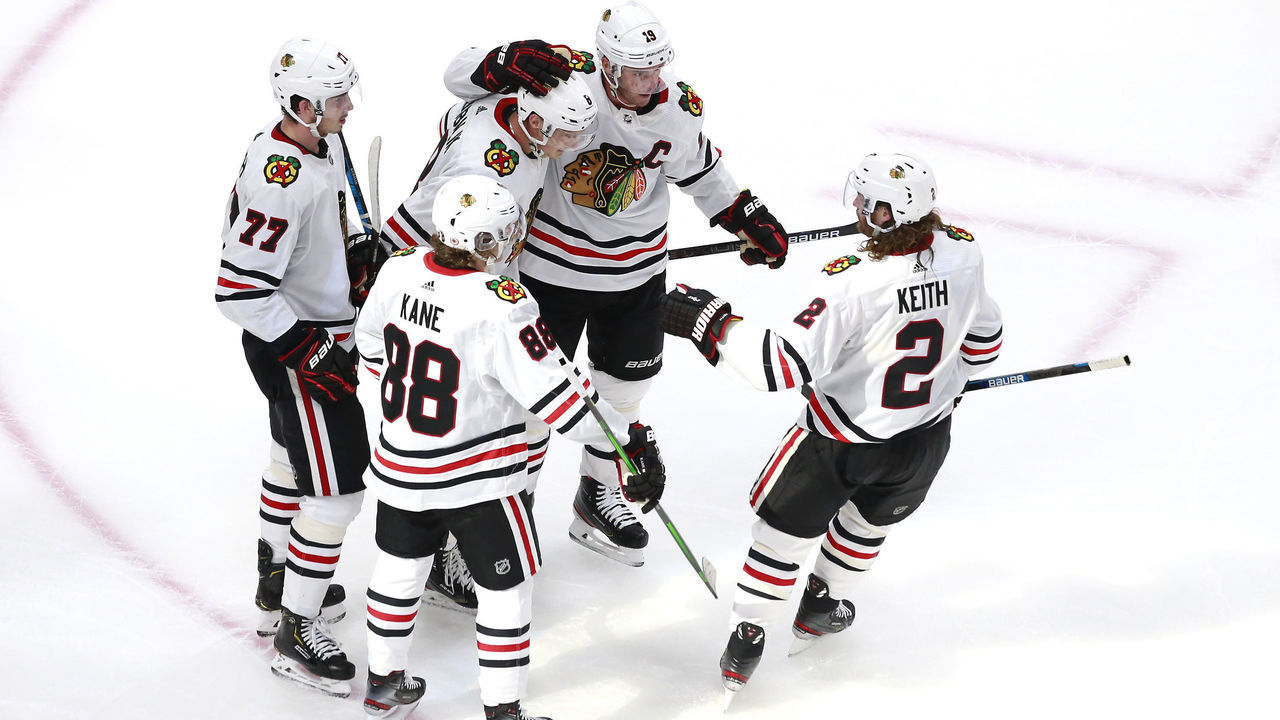 EDMONTON, ALBERTA - AUGUST 01: Dominik Kubalik #8 of the Chicago Blackhawks is congratulated by teammates Jonathan Toews #19, Patrick Kane #88, Kirby Dach #77 and Duncan Keith #2 after Kubalik scored on a power play in the second period during Game One of the Eastern Conference Qualification Round prior to the 2020 NHL Stanley Cup Playoffs at Rogers Place on August 01, 2020 in Edmonton, Alberta.