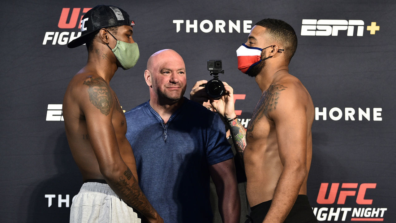 LAS VEGAS, NEVADA - JULY 31: In this handout image provided by UFC, (L-R) Opponents Kevin Holland and Trevin Giles face off during the UFC Fight Night weigh-in at UFC APEX on July 31, 2020 in Las Vegas, Nevada.