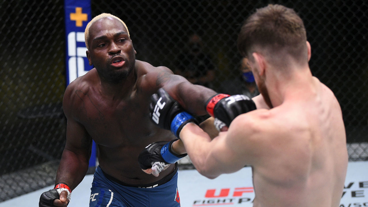 LAS VEGAS, NEVADA - AUGUST 01: (L-R) Derek Brunson punches Edmen Shahbazyan in their middleweight fight during the UFC Fight Night event at UFC APEX on August 01, 2020 in Las Vegas, Nevada.