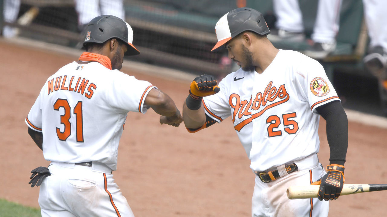 BALTIMORE, MD - AUGUST 02: Cedric Mullins #31 of the Baltimore Orioles celebrates scoring a run with Anthony Santander #25 on a Hanser Alberto #57 (not pictured) double in the seventh inning during a baseball game against the Tampa Bay Rays on August 2, 2020 at Oriole Park at Camden Yards in Baltimore, Maryland.