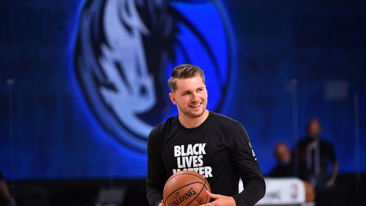 Orlando, FL - JULY 31: Luka Doncic #77 of the Dallas Mavericks warms up prior to a game against the Houston Rockets on July 31, 2020 at The Arena at ESPN Wide World Of Sports Complex in Orlando, Florida. NOTE TO USER: User expressly acknowledges and agrees that, by downloading and/or using this Photograph, user is consenting to the terms and conditions of the Getty Images License Agreement. Mandatory Copyright Notice: Copyright 2020 NBAE