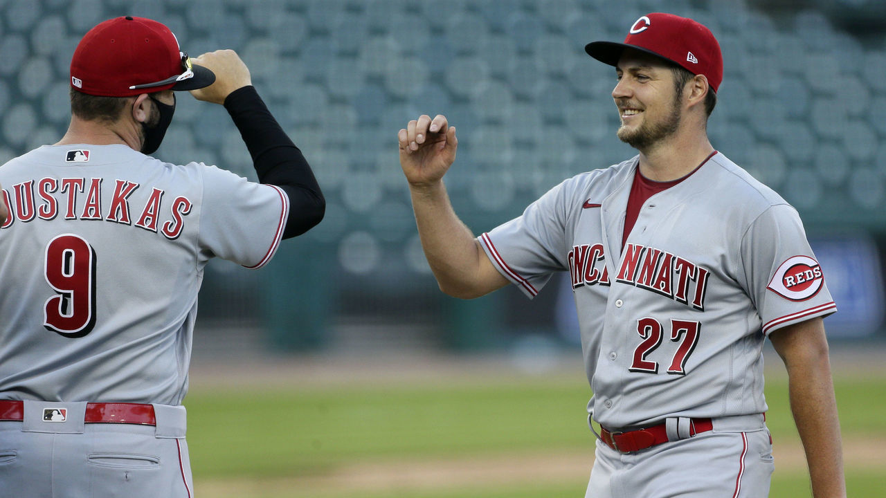 DETROIT, MI - AUGUST 2: Trevor Bauer #27 of the Cincinnati Reds smiles as he is greeted by Mike Moustakas #9 after a 4-0, even inning, complete game win over the Detroit Tigers in game two of a doubleheader at Comerica Park on August 2, 2020, in Detroit, Michigan.