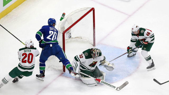 EDMONTON, ALBERTA - AUGUST 02: Alex Stalock #32 of the Minnesota Wild and Jared Spurgeon #46 of the Minnesota Wild defend the net against Brandon Sutter #20 of the Vancouver Canucks in Game One of the Western Conference Qualification Round prior to the 2020 NHL Stanley Cup Playoffs at Rogers Place on August 02, 2020 in Edmonton, Alberta, Canada.