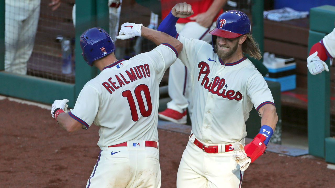 PHILADELPHIA, PA - JULY 25: J.T. Realmuto #10 of the Philadelphia Phillies celebrates with Bryce Harper #3 after hitting a three-run home run in the seventh inning during a game against the Miami Marlins at Citizens Bank Park on July 25, 2020 in Philadelphia, Pennsylvania. The 2020 season had been postponed since March due to the COVID-19 pandemic.