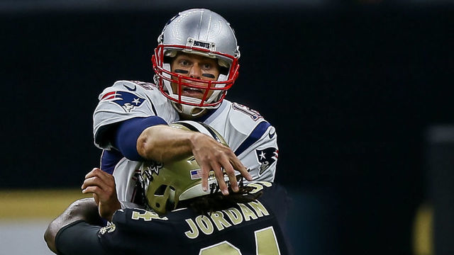 NEW ORLEANS, LA. - SEPTEMBER 17: New England Patriots quarterback Tom Brady (12) gets the ball off before being hit by New Orleans Saints defensive end Cameron Jordan (94) during the game between between the New England Patriots and the New Orleans Saints on September 17, 2017 at the Mercedes-Benz Superdome in New Orleans, LA. New England Patriots won 36-20.