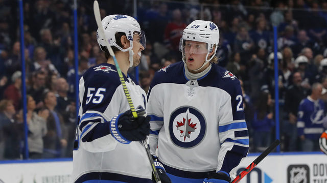 TAMPA, FL - NOVEMBER 16: Winnipeg Jets right wing Patrik Laine (29) talks to Winnipeg Jets center Mark Scheifele (55) during the NHL game between the Winnipeg Jets and Tampa Bay Lightning on November 16, 2019 at Amalie Arena in Tampa, FL.