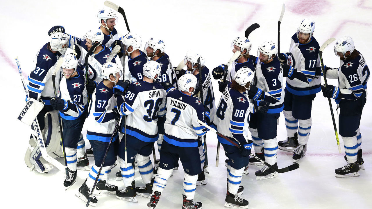 EDMONTON, ALBERTA - AUGUST 03: The Winnipeg Jets celebrate the win over the Calgary Flames after Game Two of the Western Conference Qualification Round prior to the 2020 NHL Stanley Cup Playoffs at Rogers Place on August 03, 2020 in Edmonton, Alberta. The Winnipeg Jets defeated the Calgary Flames 3-2.
