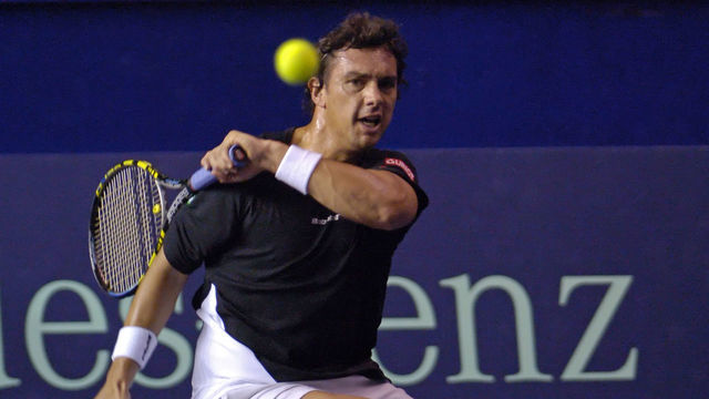 Mariano Puerta (ARG) hits a forehand during the match he played against Serb Novak Djokovic. Puerta, in his first presentation in Paris after the Roland Garros finals where he apparently has tested positive, lost to Djokovic 6-3 7-6 (11-9), and was eliminated from the 2005 BNP Paribas Masters.