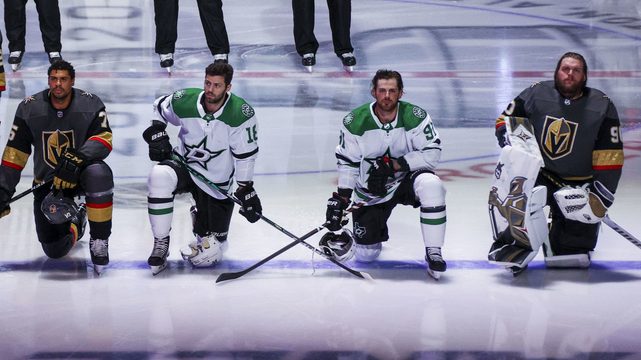 EDMONTON, ALBERTA - AUGUST 03: Ryan Reaves #75 and Robin Lehner #90 of the Vegas Golden Knights kneel during the singing of the American national anthem alongside Jason Dickinson #18 and Tyler Seguin #91 of the Dallas Stars before the start of the Round Robin game during the 2020 NHL Stanley Cup Playoff at Rogers Place on August 03, 2020 in Edmonton, Alberta.