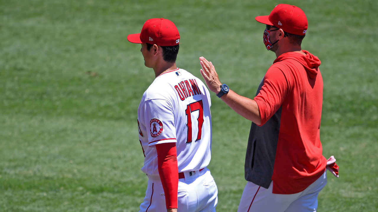 ANAHEIM, CA - AUGUST 02: Shohei Ohtani #17 walks with pitching coach Mickey Callaway #75 of the Los Angeles Angels to warm up in the bullpen before the game against the Houston Astros at Angel Stadium of Anaheim on August 2, 2020 in Anaheim, California.