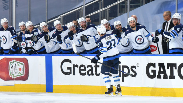 EDMONTON, ALBERTA - AUGUST 03: Nikolaj Ehlers #27 of the Winnipeg Jets celebrates his power play goal against the Calgary Flames with teammates during the third period of Game Two of the Western Conference Qualification Round prior to the 2020 NHL Stanley Cup Playoffs at Rogers Place on August 03, 2020 in Edmonton, Alberta.