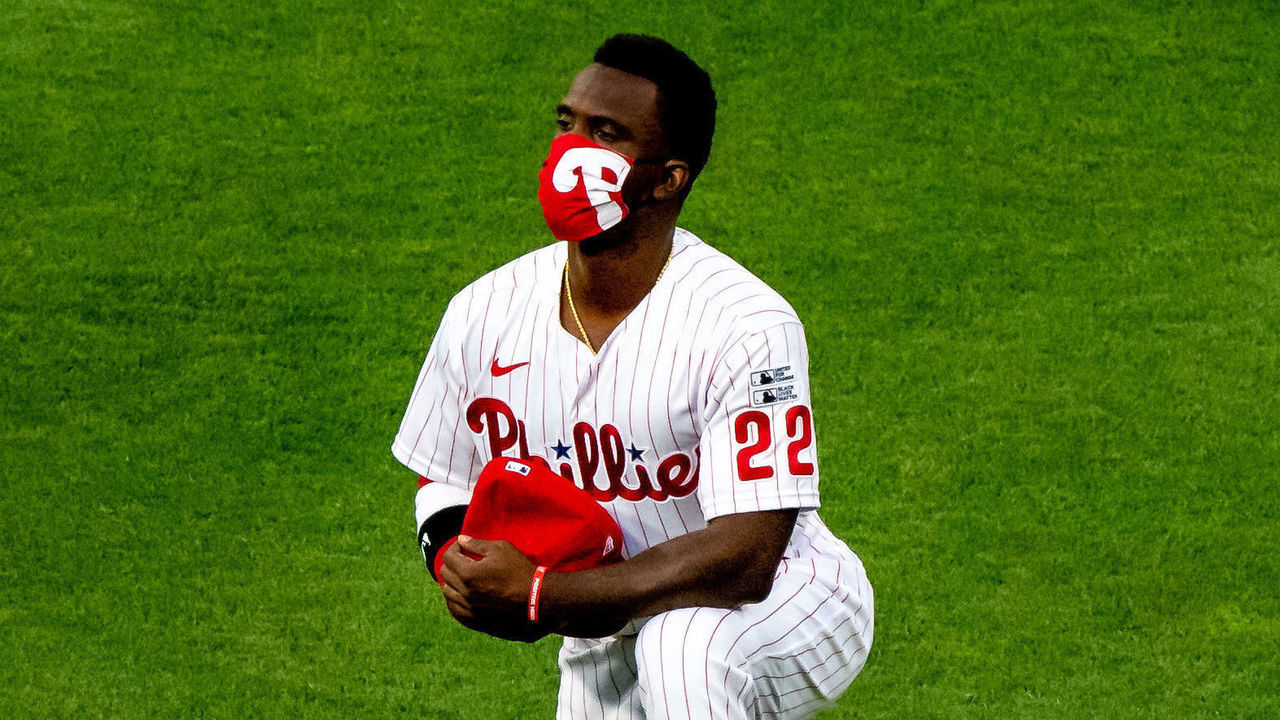 PHILADELPHIA, PA - JULY 24: Philadelphia Phillies center fielder Andrew McCutchen (22) takes a knee prior to the game between the Miami Marlins and Philadelphia Phillies on July 24, 2020 at Citizens Bank Park in Philadelphia, PA.