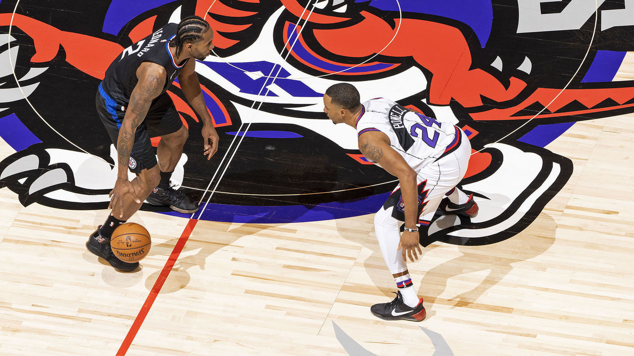 TORONTO, CANADA - DECEMBER 11: Kawhi Leonard #2 of the LA Clippers handles the ball during the game while Norman Powell #24 of the Toronto Raptors plays defense during the game on December 11, 2019 at the Scotiabank Arena in Toronto, Ontario, Canada. Mandatory Copyright Notice: Copyright 2019 NBAE