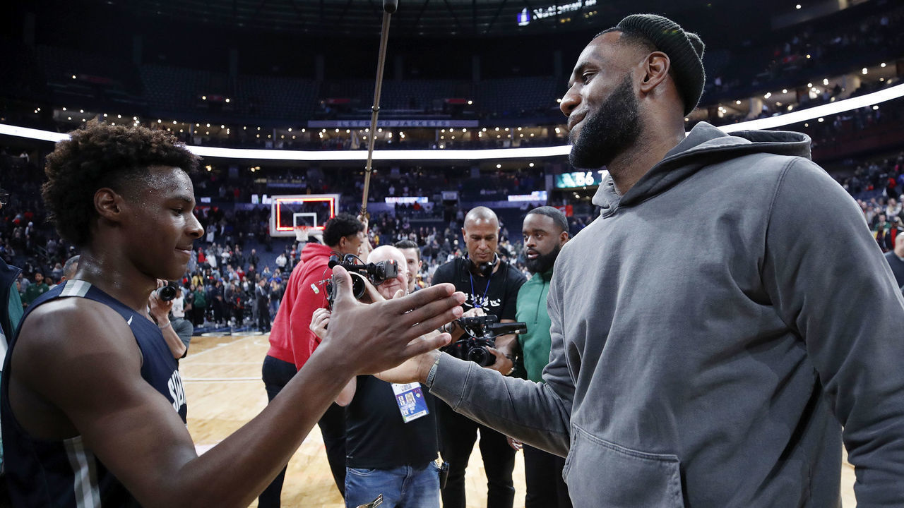 COLUMBUS, OH - DECEMBER 14: LeBron 'Bronny' James Jr. #0 of Sierra Canyon High School is greeted by his father LeBron James of the Los Angeles Lakers following the Ohio Scholastic Play-By-Play Classic against St. Vincent-St. Mary High School at Nationwide Arena on December 14, 2019 in Columbus, Ohio.