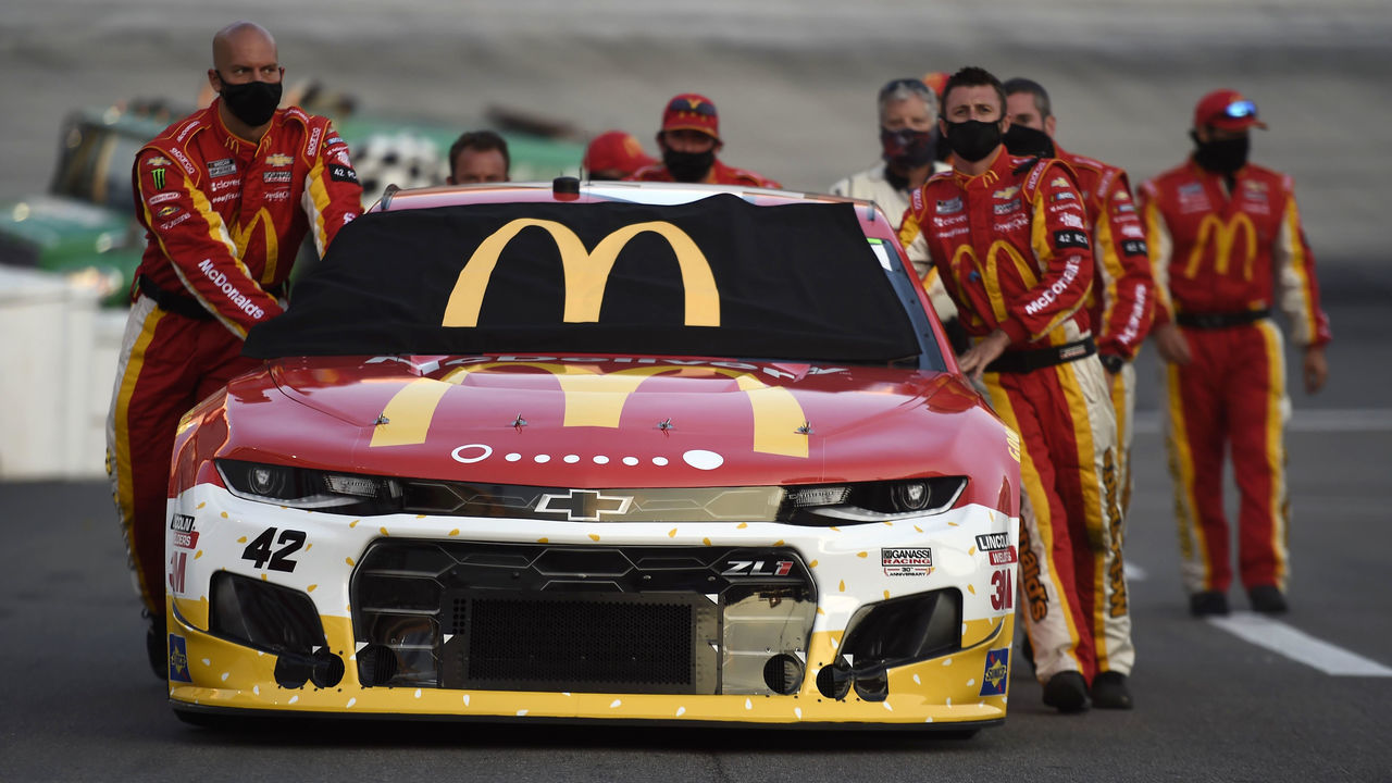 BRISTOL, TENNESSEE - JULY 15: The crew push the #42 McDonald's McDelivery Chevrolet, driven by Matt Kenseth, on the grid prior to the NASCAR Cup Series All-Star Race at Bristol Motor Speedway on July 15, 2020 in Bristol, Tennessee.