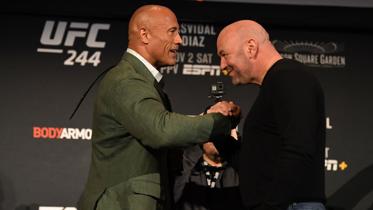 NEW YORK, NY - NOVEMBER 01: Dwayne 'The Rock' Johnson (L) holds the 'BMF' belt as he interacts with UFC President Dana White during the UFC 244 weigh-ins at the Hulu Theatre at Madison Square Garden on November 1, 2019 in New York, New York.