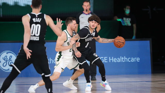 Orlando, FL - AUGUST 4: Tyler Johnson #8 of the Brooklyn Nets handles the ball during the game against the Milwaukee Bucks on August 4, 2020 at The Visa Athletic Center at ESPN Wide World Of Sports Complex in Reunion, Florida. NOTE TO USER: User expressly acknowledges and agrees that, by downloading and/or using this Photograph, user is consenting to the terms and conditions of the Getty Images License Agreement. Mandatory Copyright Notice: Copyright 2020 NBAE