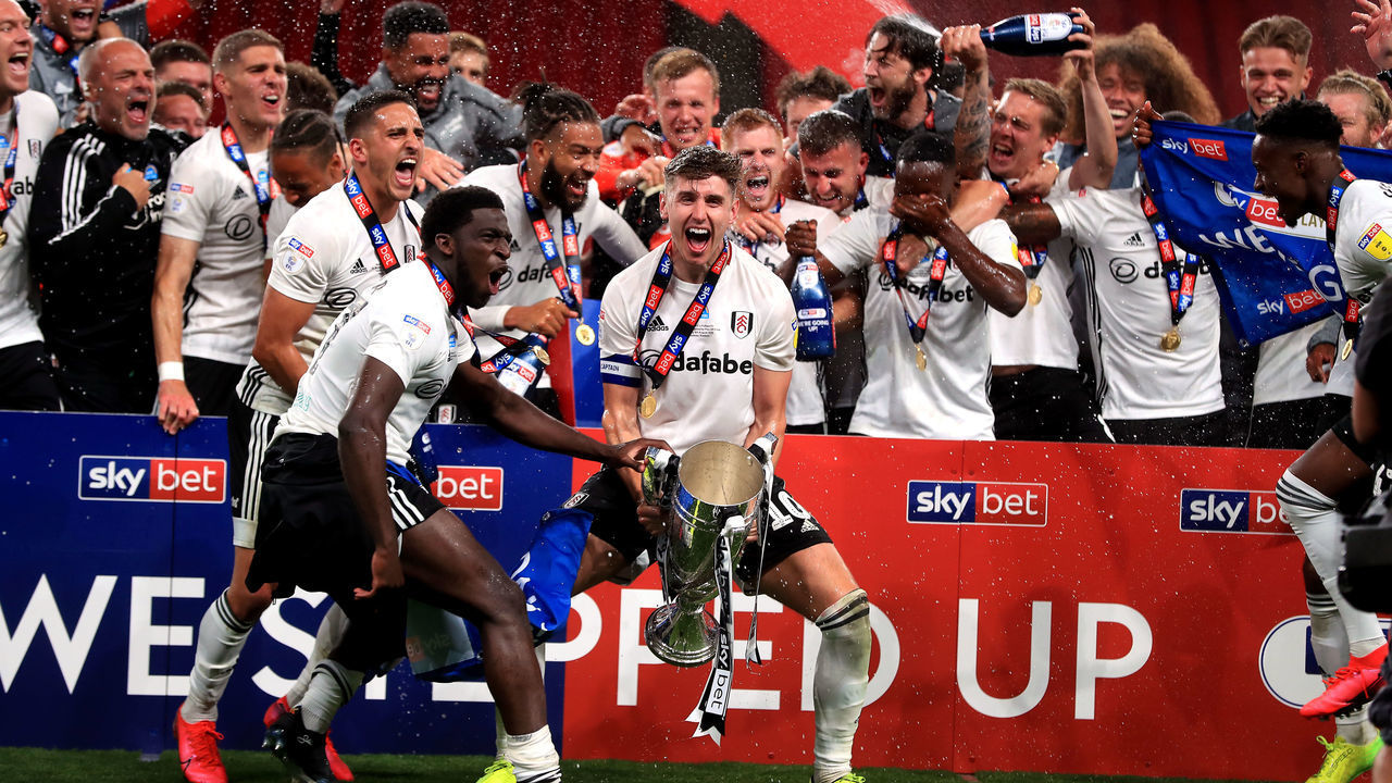 Fulhams captain Tom Cairney lifts the trophy after they win the Sky Bet Championship Play Off Final at Wembley Stadium, London.