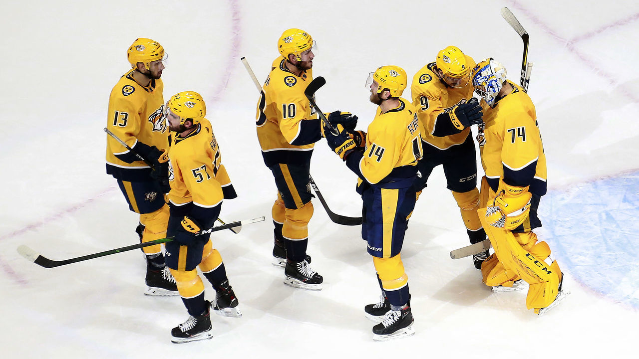 EDMONTON, ALBERTA - AUGUST 04: Juuse Saros #74 and Filip Forsberg #9 of the Nashville Predators celebrate the win with the rest of their teammates after the 4-2 win over the Arizona Coyotes in Game Two of the Western Conference Qualification Round prior to the 2020 NHL Stanley Cup Playoffs at Rogers Place on August 04, 2020 in Edmonton, Alberta.