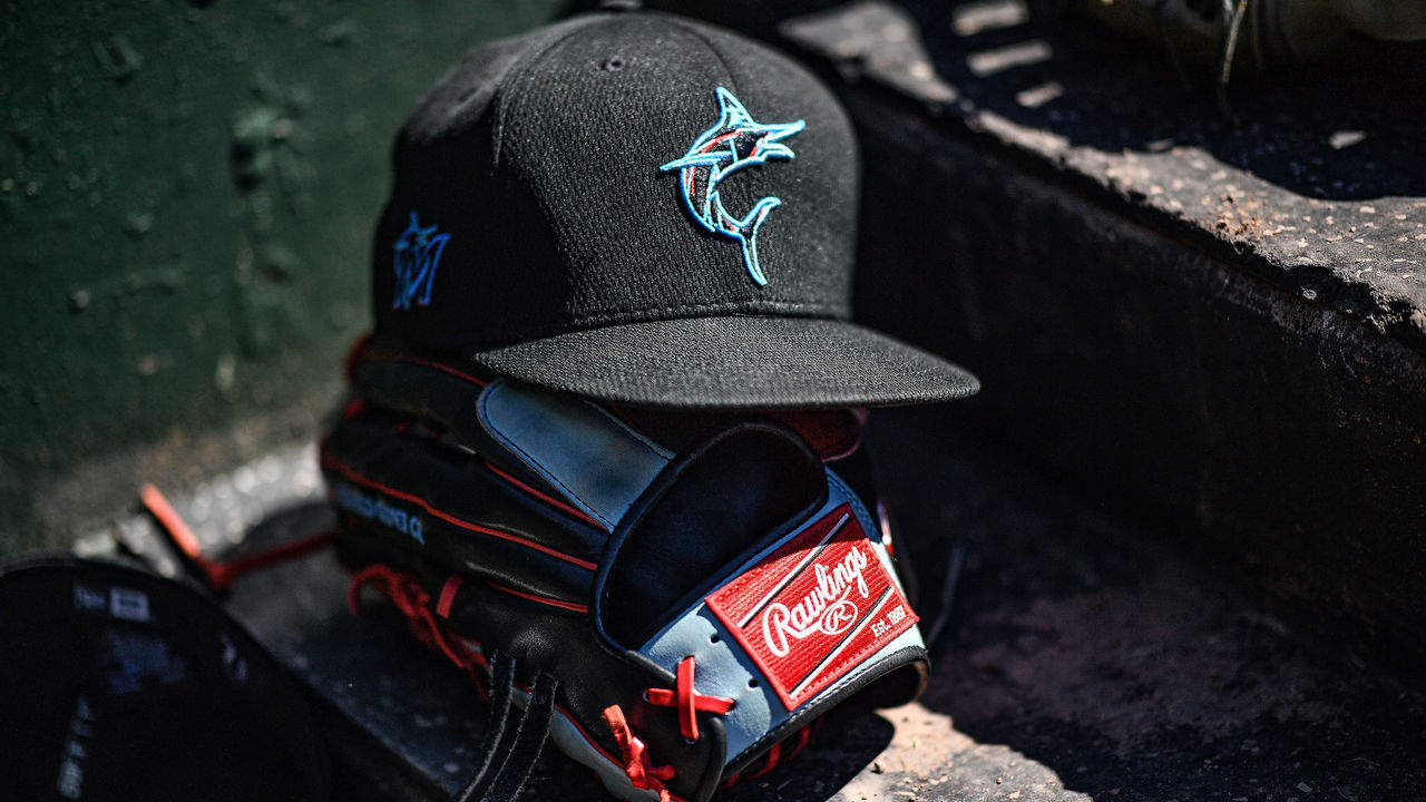 SARASOTA, FLORIDA - FEBRUARY 29: A detailed view of the Miami Marlins New Era cap resting on a Rawlings baseball glove of Monte Harrison #60 of the Miami Marlins during the spring training game against the Baltimore Orioles at Ed Smith Stadium on February 29, 2020 in Sarasota, Florida.