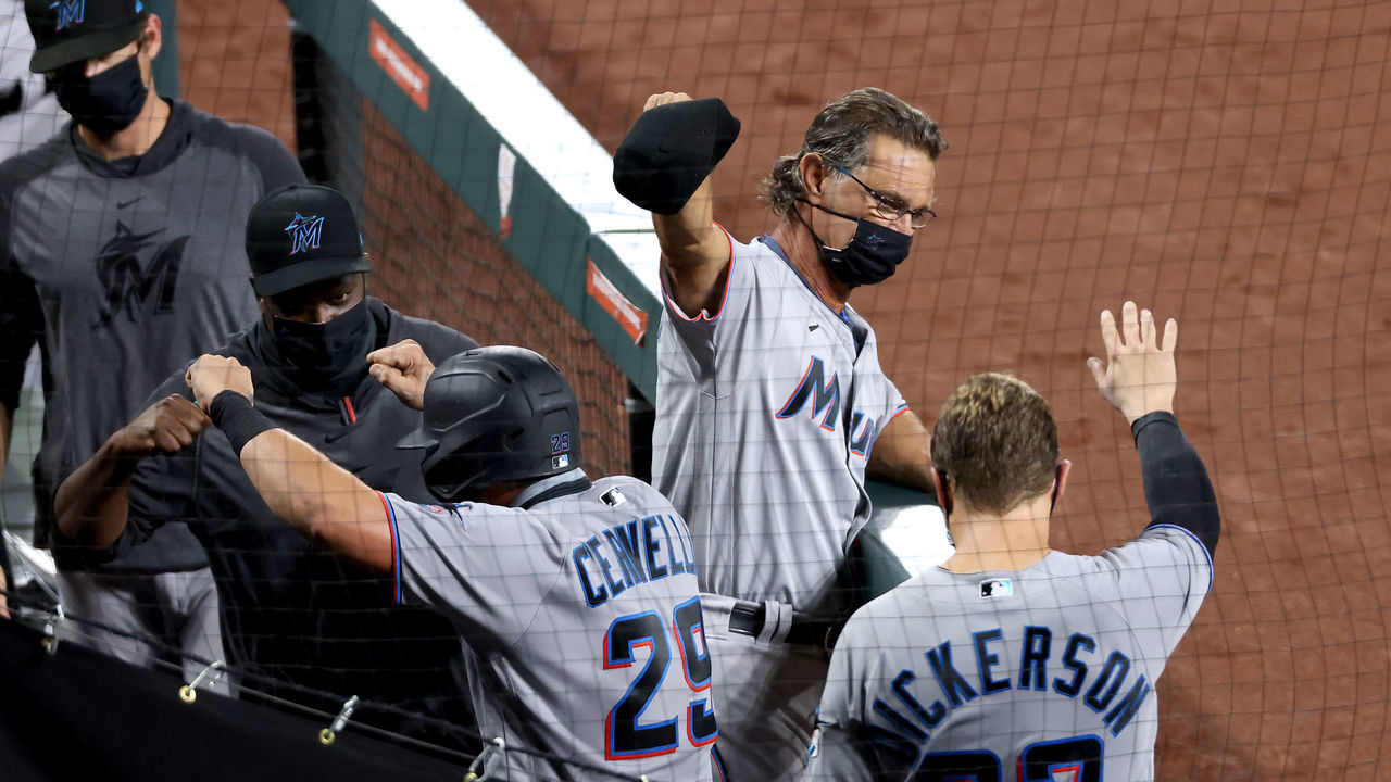 BALTIMORE, MARYLAND - AUGUST 04: Francisco Cervelli #29 of the Miami Marlins celebrates hitting a solo home run against the Baltimore Orioles with manager Don Mattingly #8 and Corey Dickerson #23 in the fifth inning at Oriole Park at Camden Yards on August 04, 2020 in Baltimore, Maryland.